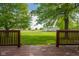 Image of a spacious green backyard framed by the wooden posts of a stained deck at 2221 W County Road 500 N, Danville, IN 46122