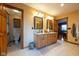 Bathroom with double vanity sink with wood cabinets adjacent to an enclosed toilet at 2221 W County Road 500 N, Danville, IN 46122