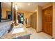 Bathroom featuring a sink, vanity, and dark wood door to shower and bedroom at 2221 W County Road 500 N, Danville, IN 46122