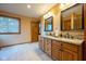 Bathroom featuring a double sink vanity with granite countertops and wooden cabinets at 2221 W County Road 500 N, Danville, IN 46122