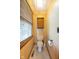 Bathroom showing a toilet and a small wood wall cabinet next to a window with closed blinds at 2221 W County Road 500 N, Danville, IN 46122