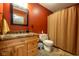 Cozy bathroom featuring wood vanity, warm lighting, and a shower with curtain at 2221 W County Road 500 N, Danville, IN 46122