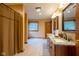 A bathroom featuring a double sink vanity with granite countertops and a wooden cabinet at 2221 W County Road 500 N, Danville, IN 46122