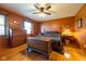 Bedroom featuring hardwood floors, a ceiling fan, and ample natural light at 2221 W County Road 500 N, Danville, IN 46122