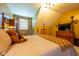 Bedroom boasts a four-poster bed, wood furniture, plush carpeting, and neutral-colored bedding at 2221 W County Road 500 N, Danville, IN 46122