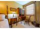 Bedroom boasts a four-poster bed, wood furniture, plush carpeting, and neutral-colored bedding at 2221 W County Road 500 N, Danville, IN 46122