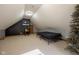 Bonus room features neutral walls, plush carpeting, a TV, and ample space for entertaining at 2221 W County Road 500 N, Danville, IN 46122
