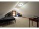 Bonus room features neutral walls, plush carpeting, a TV, and ample space for entertaining at 2221 W County Road 500 N, Danville, IN 46122