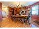 Charming dining room featuring rustic furniture, hardwood floors, and natural light at 2221 W County Road 500 N, Danville, IN 46122