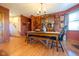 Charming dining room featuring rustic furniture, hardwood floors, and natural light at 2221 W County Road 500 N, Danville, IN 46122