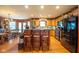 Beautiful kitchen features custom wood cabinets, granite countertops, stainless steel appliances, and a breakfast bar at 2221 W County Road 500 N, Danville, IN 46122