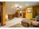Cozy living area with plush seating, warm lighting, and a charming ceiling fan at 2221 W County Road 500 N, Danville, IN 46122