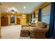 Comfortable living room with plush seating, natural light, and a decorative ceiling fan at 2221 W County Road 500 N, Danville, IN 46122