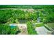 Picturesque aerial view of a property with a pond, swimming pool, and multiple buildings at 2240 Bill Smith Rd, Martinsville, IN 46151