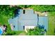 Home's roof, pool, and surrounding greenery are visible from above in this aerial shot at 2240 Bill Smith Rd, Martinsville, IN 46151