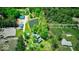 Stunning aerial view of a private property with pond, pool, lush greenery, and multiple buildings on the acreage at 2240 Bill Smith Rd, Martinsville, IN 46151