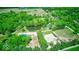 Aerial view featuring a pond, home, pool, outbuildings, and beautiful green landscaping at 2240 Bill Smith Rd, Martinsville, IN 46151