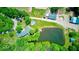 Aerial view of a property featuring a house, pond, pool, and outbuildings at 2240 Bill Smith Rd, Martinsville, IN 46151
