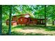 The property features a large backyard, wood deck and is surrounded by mature trees at 2240 Bill Smith Rd, Martinsville, IN 46151
