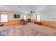 Spacious finished basement featuring a comfortable armchair, television, and natural light from several windows at 2240 Bill Smith Rd, Martinsville, IN 46151