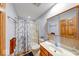 Bathroom featuring a sink, toilet, and a shower with a marble-patterned curtain at 2240 Bill Smith Rd, Martinsville, IN 46151