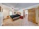 A comfortable bedroom features a large bed, ceiling fan, and doorway to a game room at 2240 Bill Smith Rd, Martinsville, IN 46151