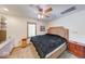 A comfortable bedroom features a large bed, ceiling fan, and a small window at 2240 Bill Smith Rd, Martinsville, IN 46151