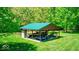 Covered boat storage area with a green metal roof, offering protection and convenience for watercraft at 2240 Bill Smith Rd, Martinsville, IN 46151