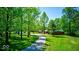 Scenic driveway leading to charming homes nestled amidst a verdant landscape at 2240 Bill Smith Rd, Martinsville, IN 46151