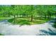 Circular driveway surrounded by mature trees, offering a picturesque entrance at 2240 Bill Smith Rd, Martinsville, IN 46151