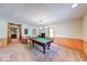 Bright game room featuring a billiard table, hanging lights, and half wall wood panels at 2240 Bill Smith Rd, Martinsville, IN 46151