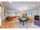 Large carpeted game room featuring a billiard table and a wall of wood panels at 2240 Bill Smith Rd, Martinsville, IN 46151