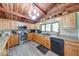 Charming kitchen with wooden cabinetry, stone countertops, and stainless steel appliances at 2240 Bill Smith Rd, Martinsville, IN 46151