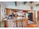 Kitchen with wood cabinets, an island with seating, and modern appliances at 2240 Bill Smith Rd, Martinsville, IN 46151