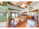 Open-concept kitchen and dining area with wood floors, island, and modern appliances at 2240 Bill Smith Rd, Martinsville, IN 46151