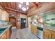 Open kitchen area with wood accents and an island, featuring a view to the living area at 2240 Bill Smith Rd, Martinsville, IN 46151