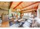 Open living room features exposed wood beams, wood paneling, and hardwood floors at 2240 Bill Smith Rd, Martinsville, IN 46151