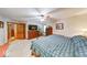 Open main bedroom with a ceiling fan, dresser, and a comfortable bed, creating a cozy retreat at 2240 Bill Smith Rd, Martinsville, IN 46151