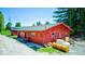 Red outbuilding has a garage door and storage space for all of your equipment with easy access on the property at 2240 Bill Smith Rd, Martinsville, IN 46151