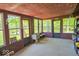 Sunroom with a rustic design and a view of the lush green yard at 2240 Bill Smith Rd, Martinsville, IN 46151