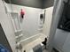 Clean bathroom featuring a shower-tub and ample storage space at 2710 Fairview St, Anderson, IN 46011