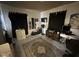 Well-lit room with a unique rug, desk space, and multiple storage options at 2710 Fairview St, Anderson, IN 46011
