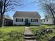 Charming single-story home with a well-maintained front lawn and inviting entryway at 2710 Fairview St, Anderson, IN 46011