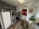 Functional kitchen with appliances, and shelving with pantry items at 2710 Fairview St, Anderson, IN 46011