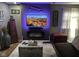 Stylish living room with modern fireplace, mounted television, and decorative accents at 2710 Fairview St, Anderson, IN 46011
