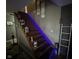 Staircase enhanced with aesthetic blue lighting and decorative lanterns at 2710 Fairview St, Anderson, IN 46011