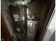Furnace and hot water tank in a compact utility space, showcasing essential home systems at 2710 Fairview St, Anderson, IN 46011