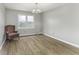 Cozy bedroom with hardwood floors and ample natural light, providing a serene retreat at 3134 W Hickory Woods Dr, Greenfield, IN 46140