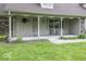 Inviting covered porch with seating, perfect for relaxing and enjoying the peaceful surroundings at 3134 W Hickory Woods Dr, Greenfield, IN 46140