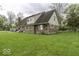 Two-story home with a combination of brick and siding on a grassy lot at 3134 W Hickory Woods Dr, Greenfield, IN 46140
